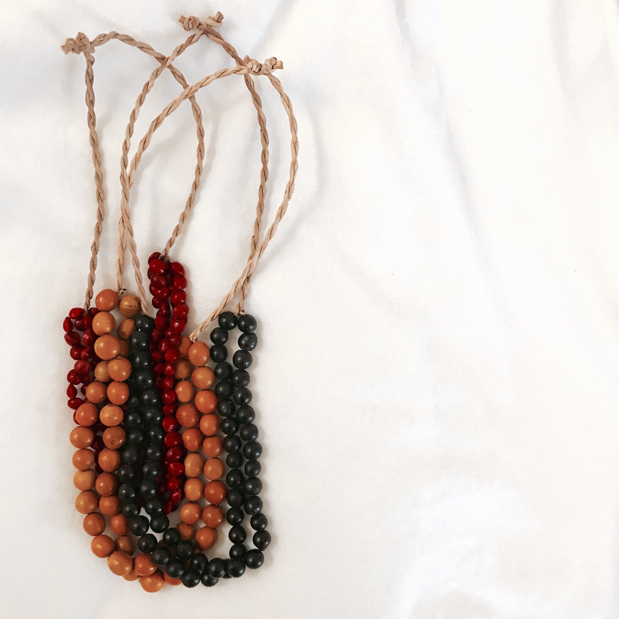 red seed necklace
