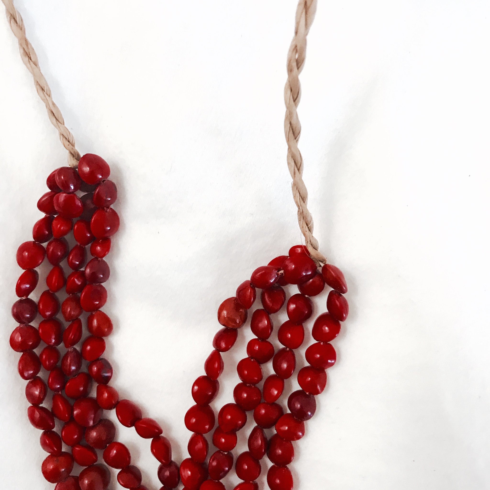 red seed necklace